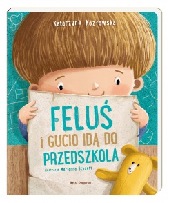 Okładka książki - narysowany chłopiec z ciemnymi włosami stoi, uśmiecha się i trzyma w rękach kartkę na której napisany jest tytuł książki